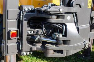 Hydraulic mechanism on construction equipment for driving a bucket on an excavator, industry, background photo