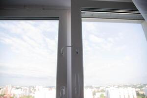 Child lock on the windows of the house, blocking device for opening windows by children. Falling from the window photo