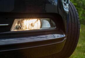 Fog lamp for adaptive illumination of the roadside in the dark when turning the steering wheel. Close-up, technology photo
