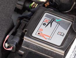 The diagram of the correct connection of the battery with the start-stop system in a passenger car, close-up, voltage photo