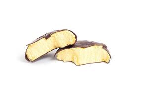 Natural delicious marshmallows in chocolate icing with lemon filling on a white plate, isolate, Traditional photo