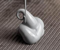 High quality automotive high temperature sealant. Gray universal one-component sealant, macro photo