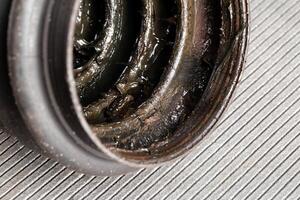 Old CV joint boot providing protection and dirt ingress into the constant velocity joint, macro photo