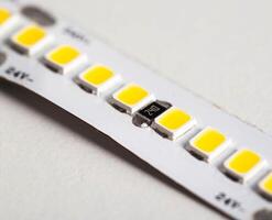 Superbright diode tape on a white background, lighting. Macro photo