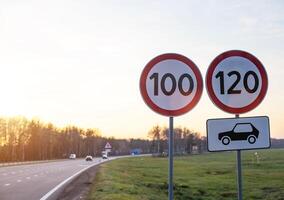 Traffic signs limit the maximum speed on the motorway. Speed and Safety Compliance Concept, copy space photo