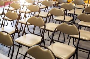 A background of comfortable modern chairs in the auditorium. Training and presentation concept, conference photo