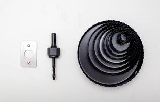 Set of cutting drills with holes for a saw on a white background, isolate, close-up photo