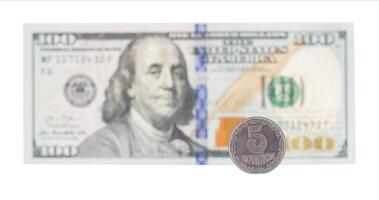 Ukrainian hryvnia next to the dollar on a white background, isolate. The concept of the relationship of Ukrainian money in relation to the dollar., The country's economy photo
