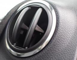 automobile modern deflector from which blows with fresh air and heat. Bad odor problem from the deflector, cleaning the recirculation system, background photo