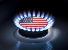 Burning gas burner of a home stove in the middle of which is the flag of the country of USA. Gas import and export delivery concept, price per cubic meter, transit, background photo