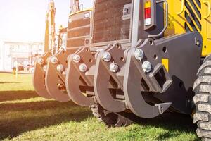 A special tool mounted on a road grader with a picker to destroy old asphalt and pavement, industry, machine photo