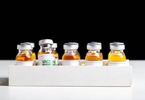 Vials of coronavirus medicine are in packaging on a white background. Vaccine test concept in a laboratory, macro photo