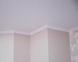 Wall with different angles and skirting boards in the room. Design solution for renovation in an apartment. Copy space for text photo