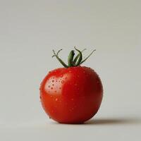 A vibrant red tomato with drops of water on its surface. photo