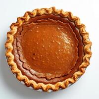 A freshly baked pumpkin pie with a golden brown crust and filling. photo
