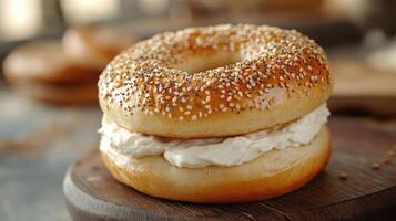 a delicious-looking bagel sandwiched between two pieces of bread spread with cream cheese and sprinkled with pepper, presented on a wooden table. photo