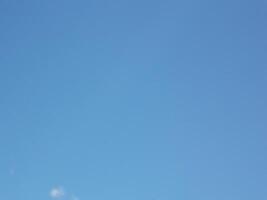 A man flying a kite in the sky photo