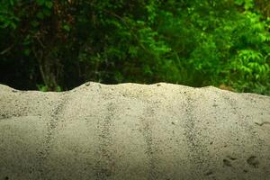 A pile of sand on a natural background is perfect for a summer-themed mockup photo