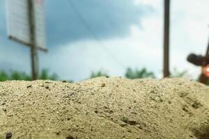 A pile of sand on a natural background is perfect for a summer-themed mockup photo