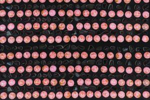 Black pink stones pebble round gems pattern photo