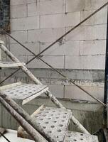 metal step worker in construction site background photo