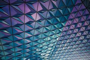 the ceiling of a building is covered in triangles photo