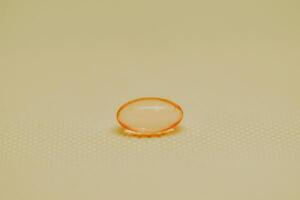 a small orange object sitting on top of a table photo