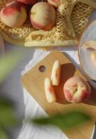 a table with a knife and a peach on it photo
