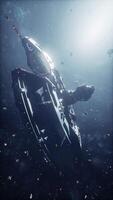 A futuristic spaceship navigates through an asteroid belt in deep space video