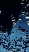 vast field of perilous asteroids stretching across a misty universe video