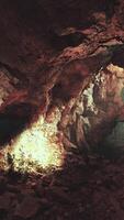 A cave filled with lots of rocks and water video