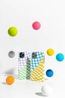 a colorful phone case with a checkered pattern and a few colorful eggs photo