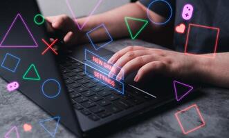Woman gaming in laptop with VR interface. Playing online concept with empty space for text. Online entertainment and gamification. photo
