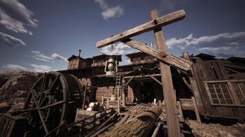 Rustic wooden structure featuring a lantern and water wheel under a cloudy sky video