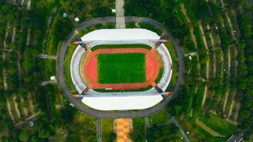 Aerial view of Palembang's largest soccer field, featuring a meticulously maintained green lawn. photo