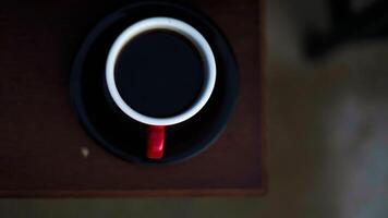 A unique coffee shop buzzes with charm, featuring captivating decor and engaging facilities. It's a perfect spot for coffee lovers and social gatherings. photo
