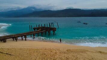 Beautiful panoramic aerial view from drone of sea bay, waves crashing on the harbor in Indonesia Mediterranean landscape, rotation, photo