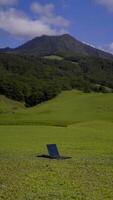 Laptop outside concept. Empty copy space, blank screen mockup. Soft focus laptop in nature background. Ecology travel and work outside office concept. photo