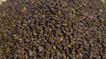 Bajawa's traditional coffee roasting process, showcasing rich beans being expertly roasted, capturing the essence of local culture and flavor. photo
