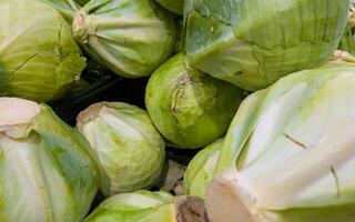 Cabbage background. Cabbage on the counter in the store. Vegetables for sale photo