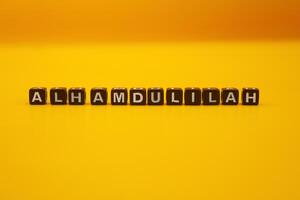 yellow background with the words alhamdulillah photo
