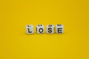 yellow background with the words lose photo