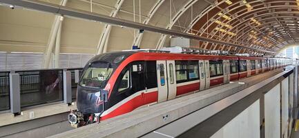 Light Rail Transit or LRT or rail transport system in Indonesia, modern metro train stationed at an urban platform, showcasing efficient public transport photo