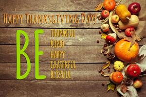 Happy thanksgiving day display on wooden background photo