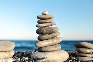 Seashore background with stone construction concept of balance and harmony photo