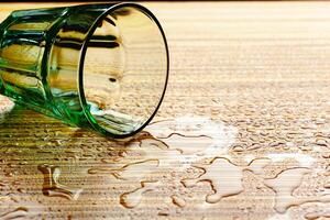 Lying down dlass and water on the table photo