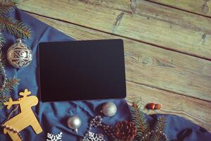Digital tablet mock up with rustic Christmas decorations photo