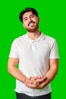 A man with a beard smiles confidently against a bright green background photo