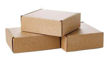Stacked brown cardboard boxes in various sizes arranged on a white background photo