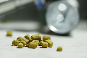 A handful of hops are scattered on a table during the brewing process photo
